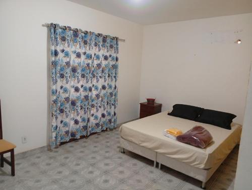 Ένα ή περισσότερα κρεβάτια σε δωμάτιο στο Pousada recanto das ondas