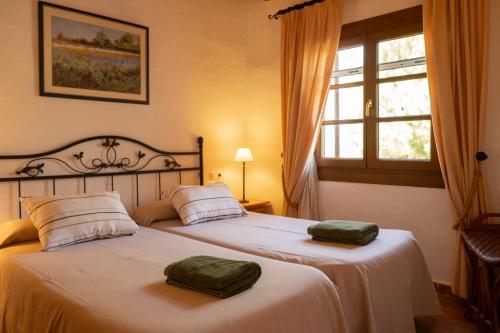 Postel nebo postele na pokoji v ubytování Agroturismo Son Marge