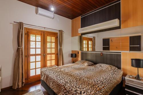 Postel nebo postele na pokoji v ubytování Casa de Campo com Piscina, Churrasqueira e Hidro