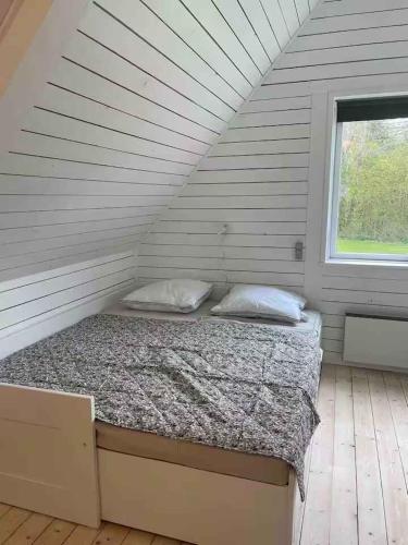 Кровать или кровати в номере Sommerhus Med Spa, Sauna Og Vildmarksbad
