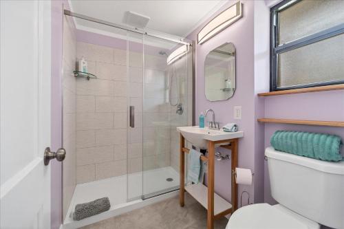 a bathroom with a shower and a sink at Southside Village Resort Apartments by Lucky Vacation Homes in Sarasota