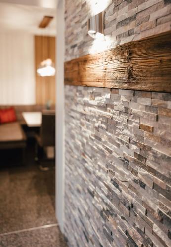 a stone wall in an office with a brick wall at Appartement Dollnig in Flattach