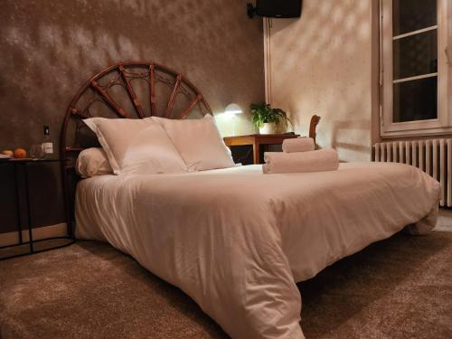 Postel nebo postele na pokoji v ubytování hôtel et restaurant les2M