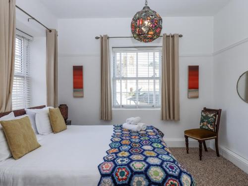 Ένα ή περισσότερα κρεβάτια σε δωμάτιο στο Delmonte Lodge