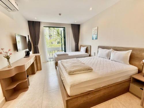 Postel nebo postele na pokoji v ubytování Minh Anh Hotel