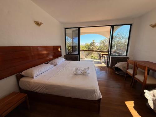 En eller flere senge i et værelse på Galapagos Yes