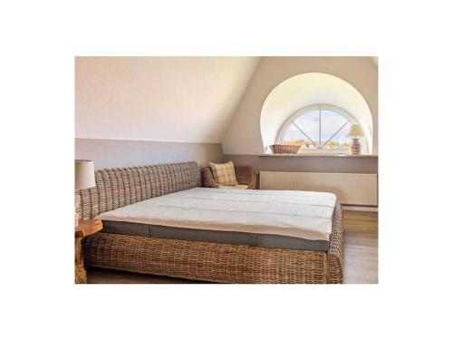 a bedroom with a bed and a window at Dream holiday under a thatched roof in Brunsbüttel