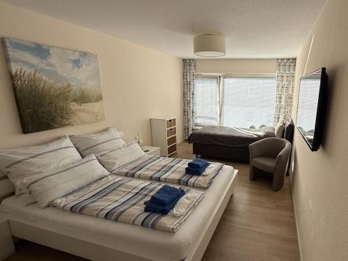 Ένα ή περισσότερα κρεβάτια σε δωμάτιο στο Seagull Seagull's Nest Scharbeutz