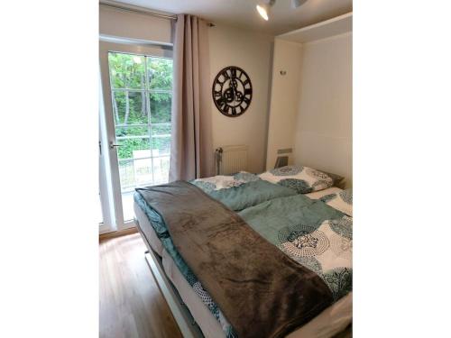 Postel nebo postele na pokoji v ubytování Holiday apartment Godenblick in Bad Malente