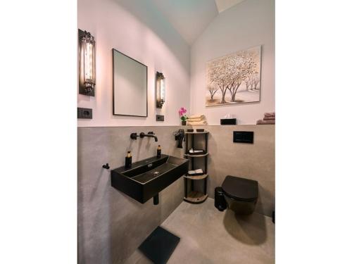 Et badeværelse på Holiday rooms with 0 bedrooms