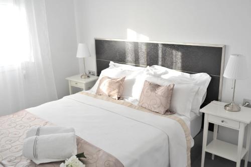 Ένα ή περισσότερα κρεβάτια σε δωμάτιο στο Ático vista mar con terraza