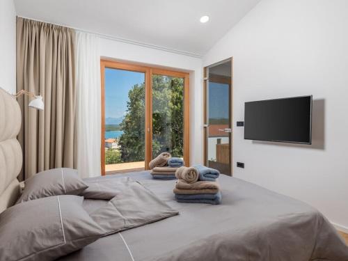 Postel nebo postele na pokoji v ubytování Villa 4 Soline, Krk, by 4villas eu