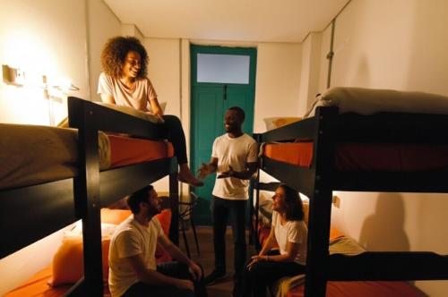 Un pat sau paturi într-o cameră la Hobi Hotel Boutique