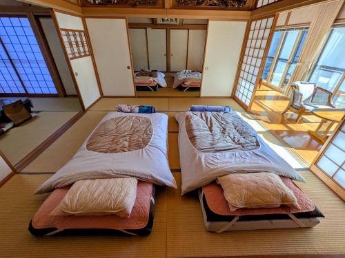 Voodi või voodid majutusasutuse Auberge Fujii Fermier toas