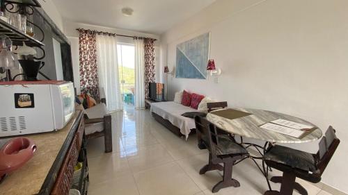 Giường trong phòng chung tại Apartamento Vista Mar até 4 hóspedes