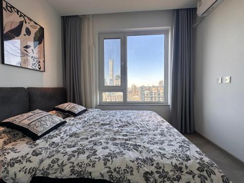 Postel nebo postele na pokoji v ubytování Beijing city center- Two bedrooms with CBD city view