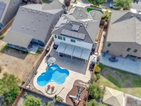 an overhead view of a large house with a pool at Casa Cortez in Visalia