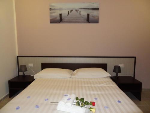 a bedroom with a bed with shoes and a pier at Affittacamere Rooms Di Matteo in San Paolo di Iesi