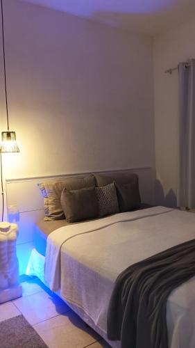 Ένα ή περισσότερα κρεβάτια σε δωμάτιο στο Casa aconchegante