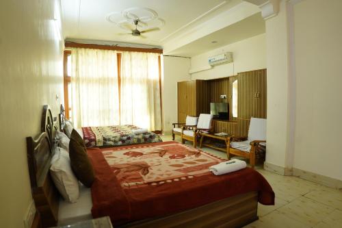 Postel nebo postele na pokoji v ubytování Besillio Grand- A Hotel With Bar & Restaurant