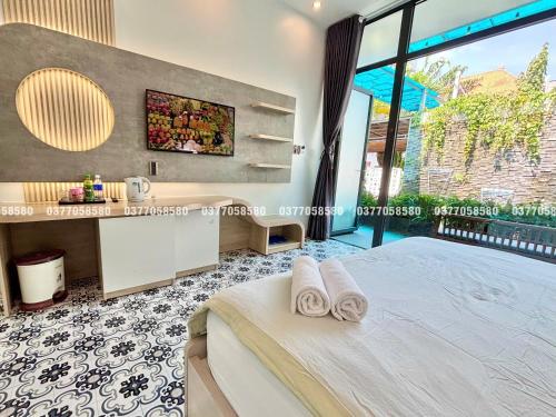 Un pat sau paturi într-o cameră la Sea House Hotels and Apartments