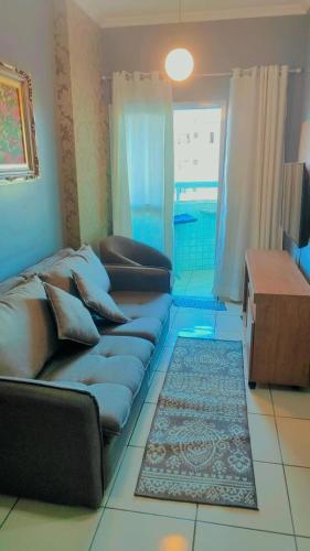 Et opholdsområde på APARTAMENTO PRAIA GRANDE, Varanda Gourmet & Vaga de Garagem