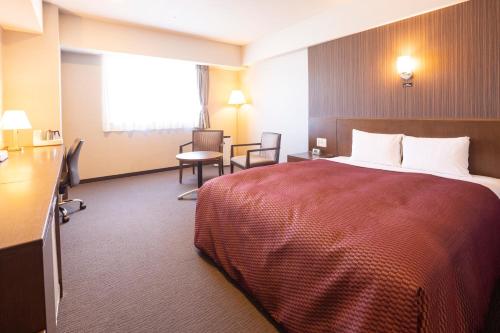 Ένα ή περισσότερα κρεβάτια σε δωμάτιο στο Castle Inn Toyokawa