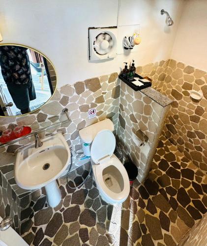 a bathroom with a sink and a toilet and a mirror at Best Seller Beach Villa Full View At Kohchang Resort in Ko Chang