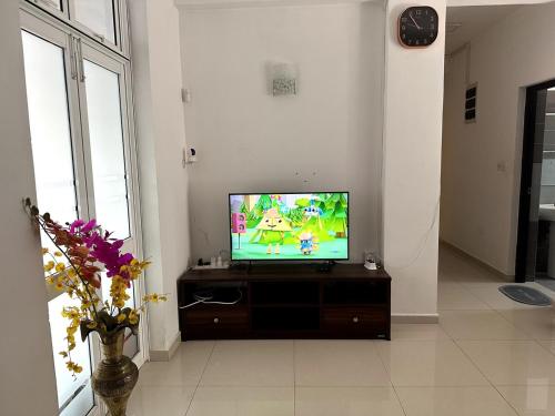 a flat screen tv sitting in a living room at Prime Residencies Panadura - Convenient Apartment in Panadura