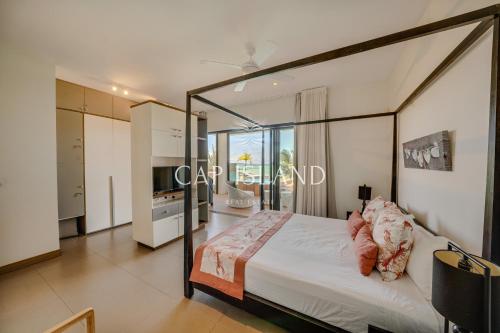 En eller flere senge i et værelse på Penthouse 3 chambres Vue Lagon imprenable