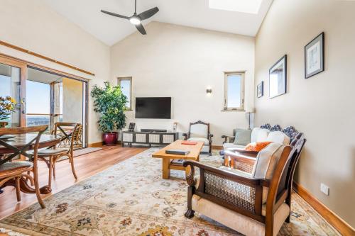 a living room with a couch and a table at Crater View Boutique Eco Apartment in Koroit