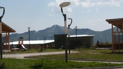 a street light in a park with a playground at New Gudauri Sunny studio in Gudauri