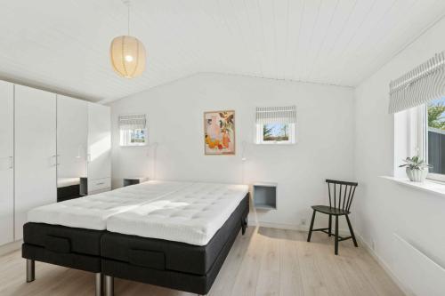 En eller flere senge i et værelse på Quiet Holiday Home With Annex And Great Outdoor