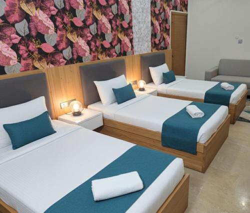 En eller flere senge i et værelse på Karachi Motel Guest House - Near Aiport