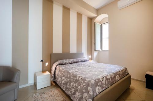 Ένα ή περισσότερα κρεβάτια σε δωμάτιο στο Martini Matera apartment