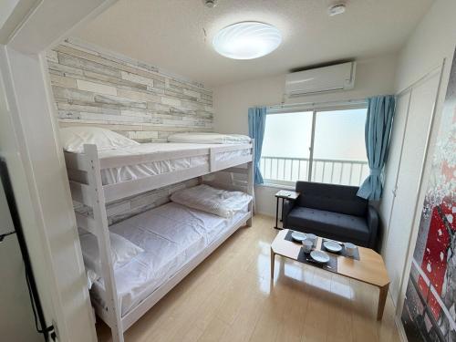 En eller flere senge i et værelse på ハイツ緑ヶ丘206