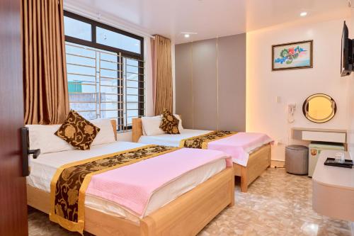 Ένα ή περισσότερα κρεβάτια σε δωμάτιο στο Ngoc Linh Hostel and Travel