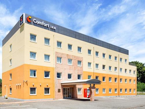 a building with a sign on top of it at Comfort Inn Shiojiri Kita Inter in Shiojiri