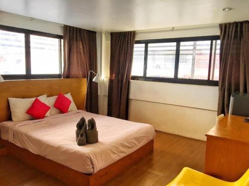 Una cama o camas en una habitación de Iroom Hotel