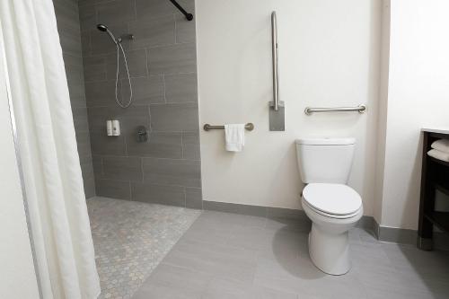 a bathroom with a toilet and a shower at Quality Inn & Suites Circleville in Circleville