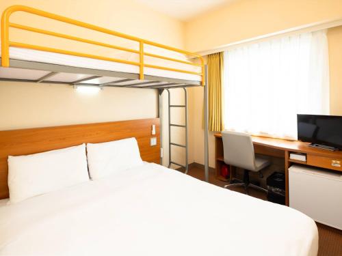 Ένα ή περισσότερα κρεβάτια σε δωμάτιο στο Comfort Inn Kurashiki Mizushima