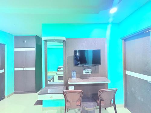 Μια τηλεόραση ή/και κέντρο ψυχαγωγίας στο ফোর স্কয়ার Four Square Lite Heaven Digha Near The Sea Beach