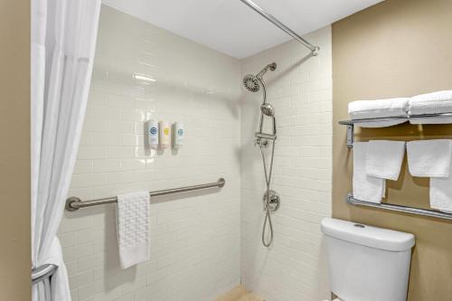a bathroom with a shower and a toilet at Comfort Inn & Suites Pottstown Eastern Gateway in Pottstown