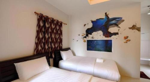 Postel nebo postele na pokoji v ubytování Sixty-nine Resort