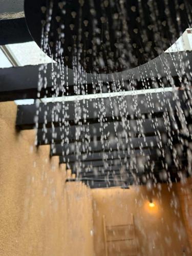 a shower with water coming out of it at Eco Bricks in Ahangama