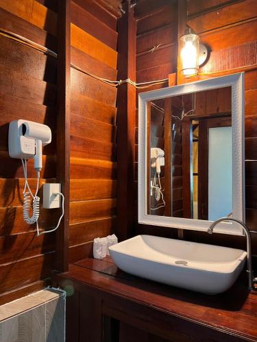 a bathroom with a sink and a mirror at Bayview Sunset in Ko Lipe