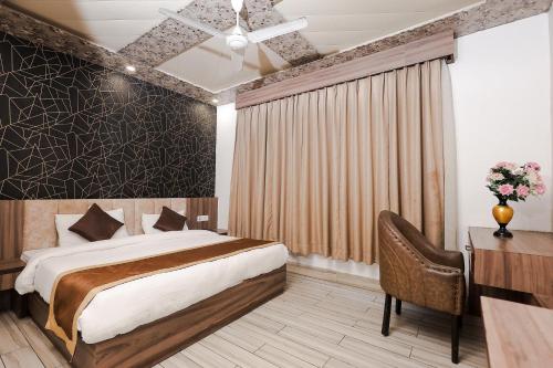 Ένα ή περισσότερα κρεβάτια σε δωμάτιο στο Sparsh Village Club