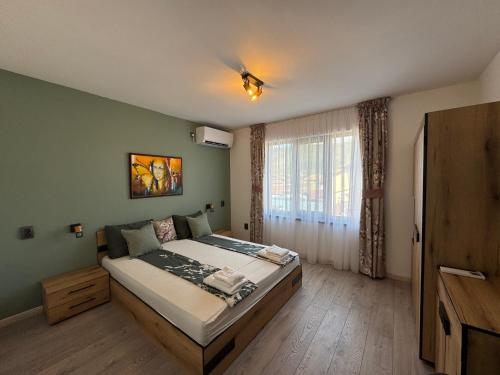 Ένα ή περισσότερα κρεβάτια σε δωμάτιο στο Kamberovi house Kalofer