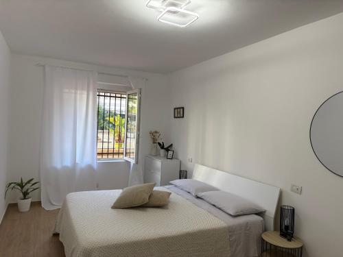 Ένα ή περισσότερα κρεβάτια σε δωμάτιο στο Magici Sogni-Bordighera