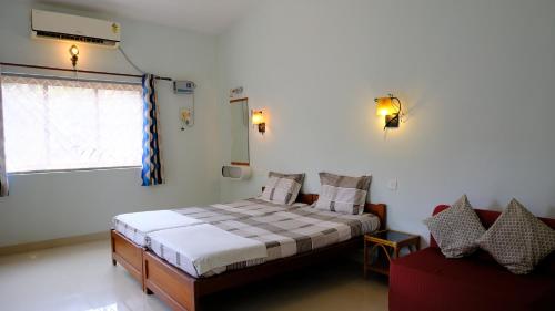 Ένα ή περισσότερα κρεβάτια σε δωμάτιο στο Sea Pearl Guesthouse